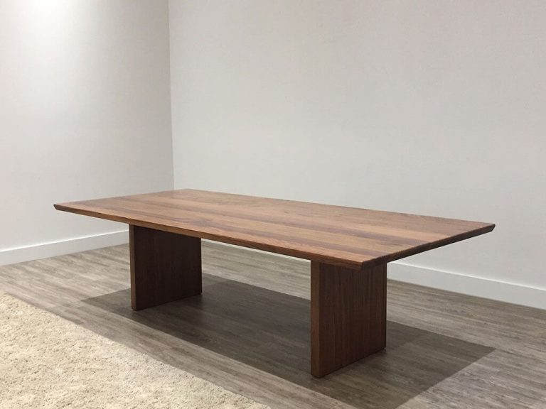 10 seater dining table made from solid timber with tapered table top and panel ends