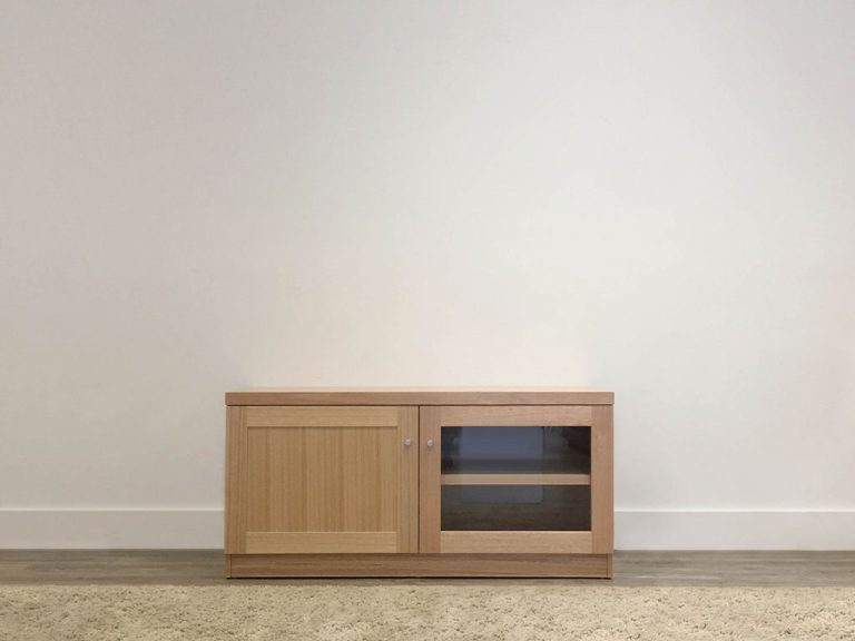 small tv cabinet with 1 timber door and 1 glass door and internal shelves made in mountain ash timber