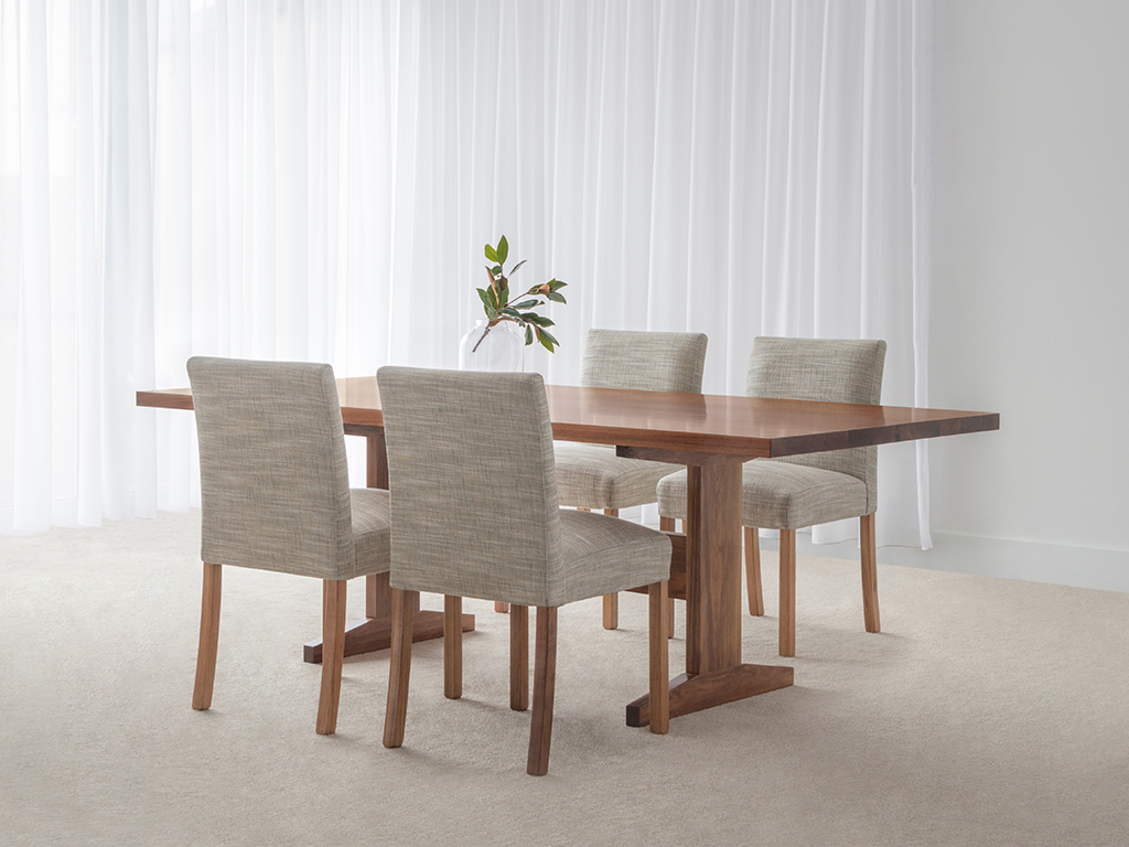 8 seater dining table set made in blackwood timber with fabric dining chairs