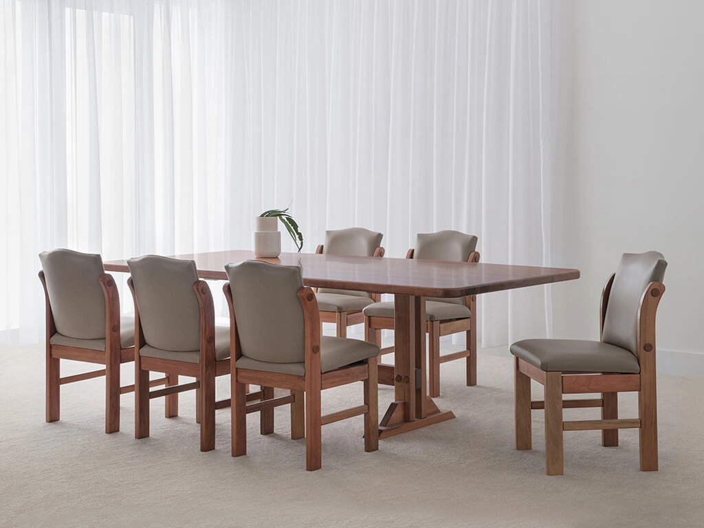 testle base dining table with tapered table top and slim features crafted in blackwood timber