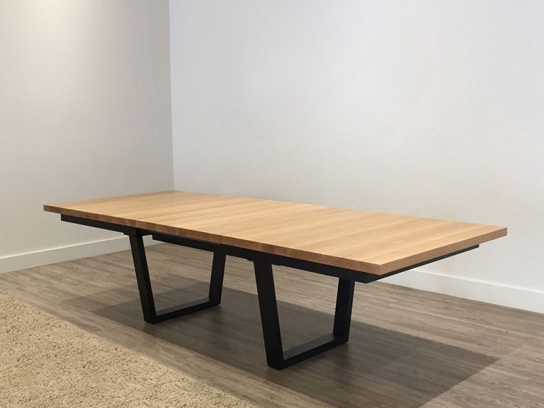 large custom timber dining table with blackwood top and modern black base