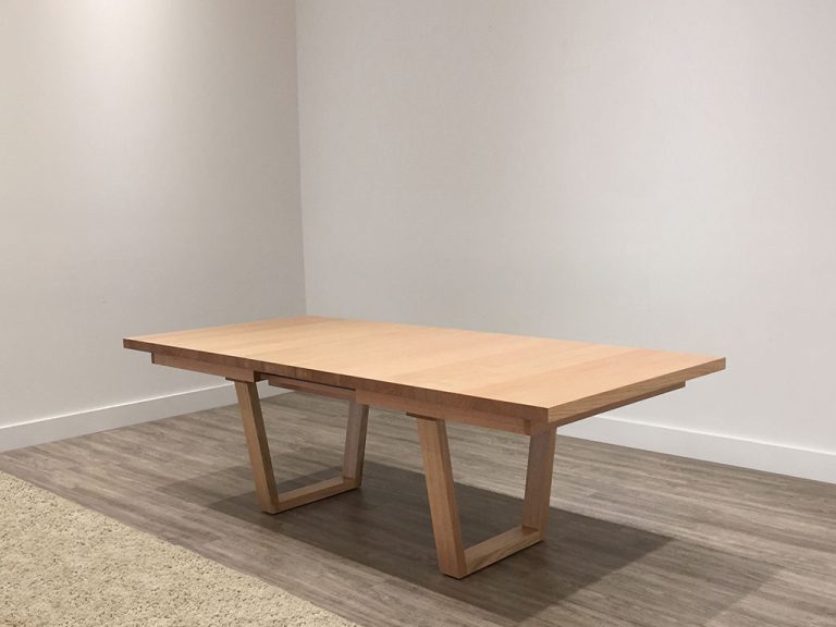 large custom timber dining table with blackwood top and modern black base