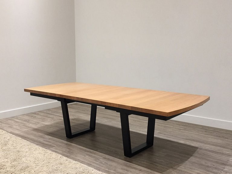 large custom timber dining table with blackwood top and modern black base