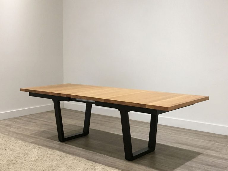 large custom timber dining table with blackwood top and modern black base