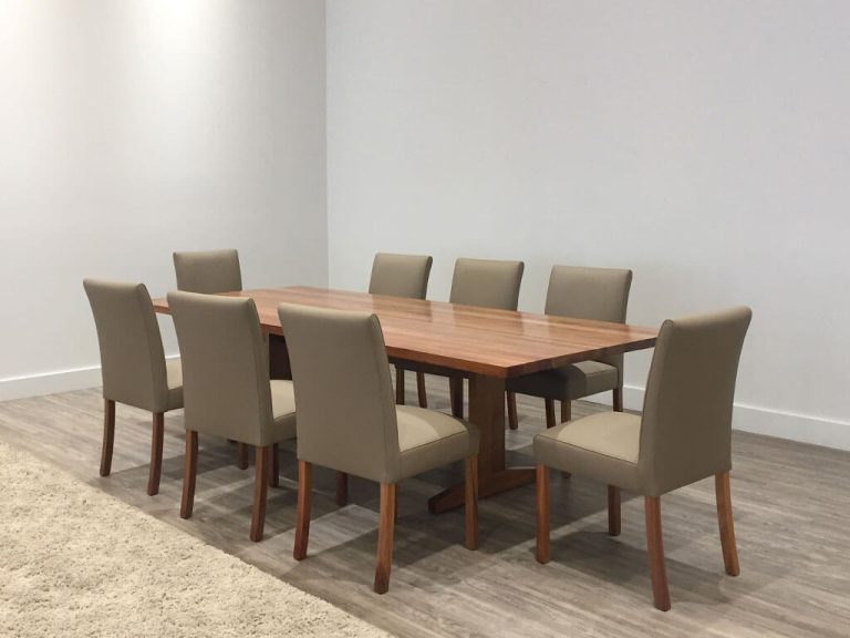 large timber dining table with pedestal base and rounded corner top made in blackwood timber