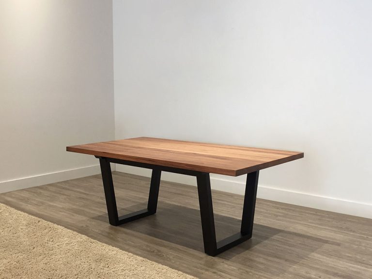 8 seater dining table with black angular legs with tasmanian blackwood table top