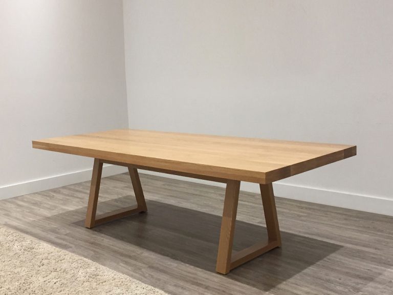 custom timber dining table with ornate table edge and traditional base