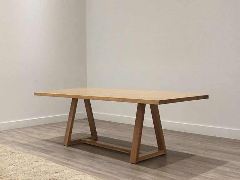 solid timber dining table with grey tone and trestle base made in adelaide