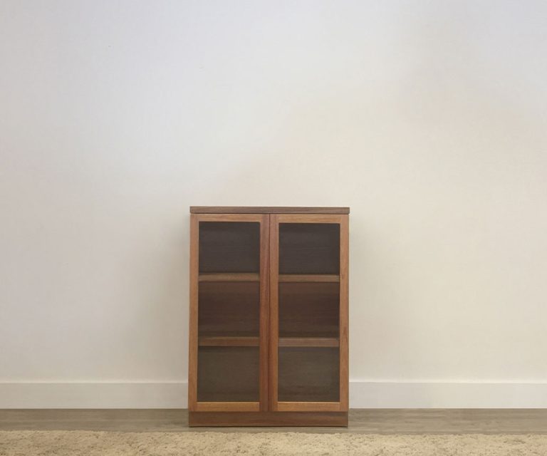 small timber display cabinet with glass doors and adjustable shelves on full base