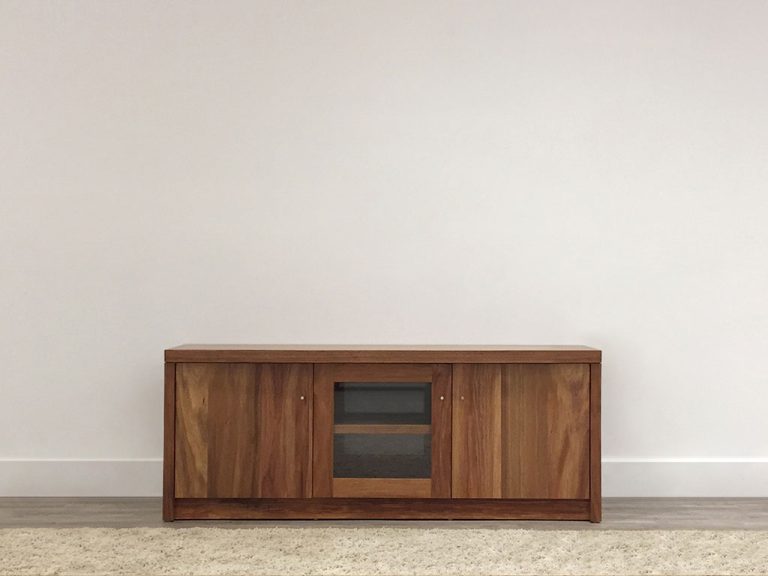 custom tv entertainment unit made in blackwood timber with glass centre door