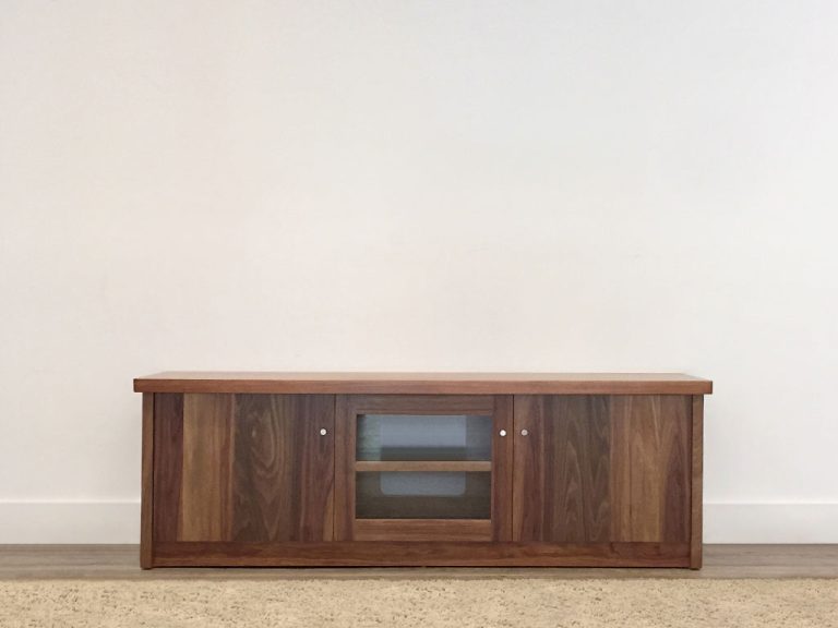 traditional tv cabinet with 3 doors and glass panel and rounded overhang top