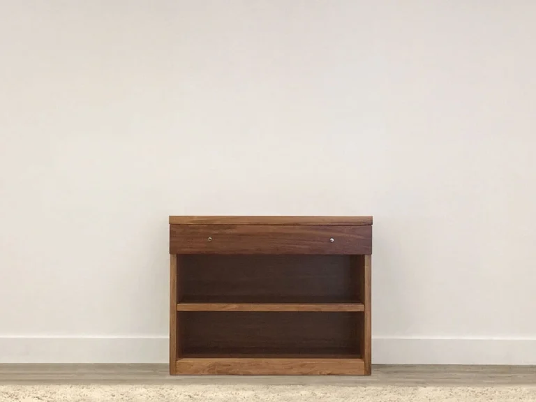 small bookcase built in blackwood with slim drawer and single shelf with square base