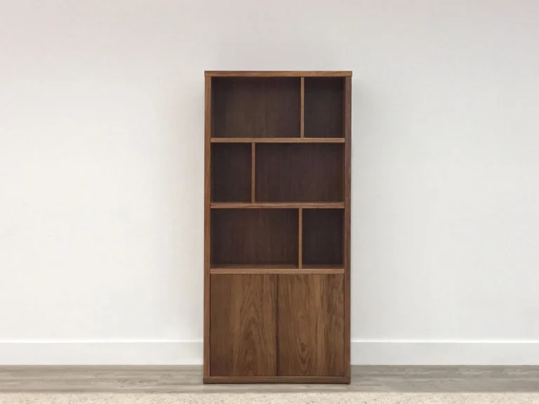 custom made narrow bookcase with mixed shelving and two door spaces in tasmanian blackwood timber made handmade locally