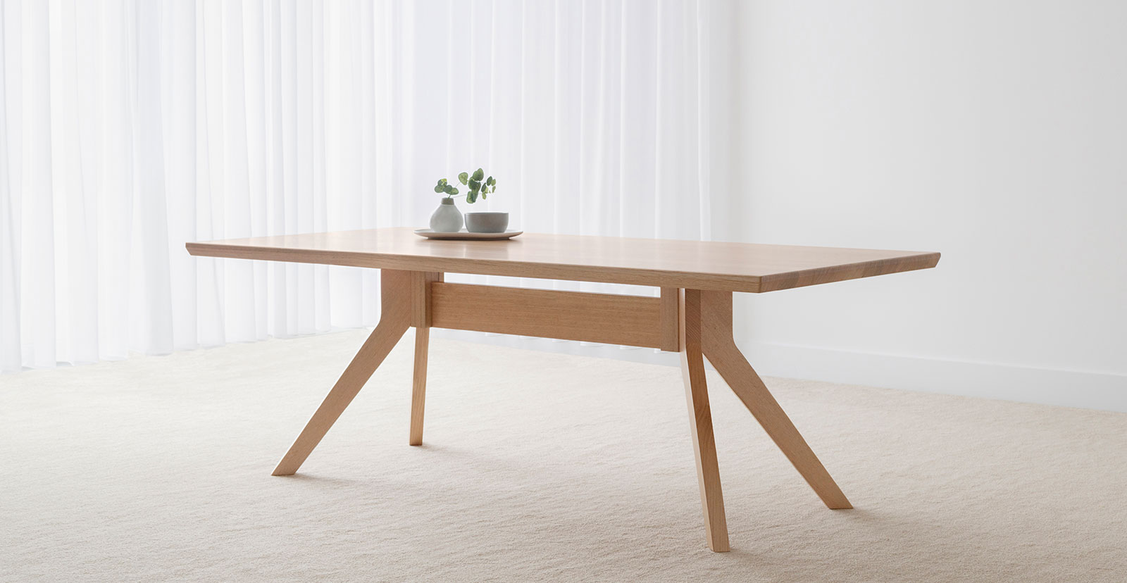 tasmanian oak dining table with angled legs