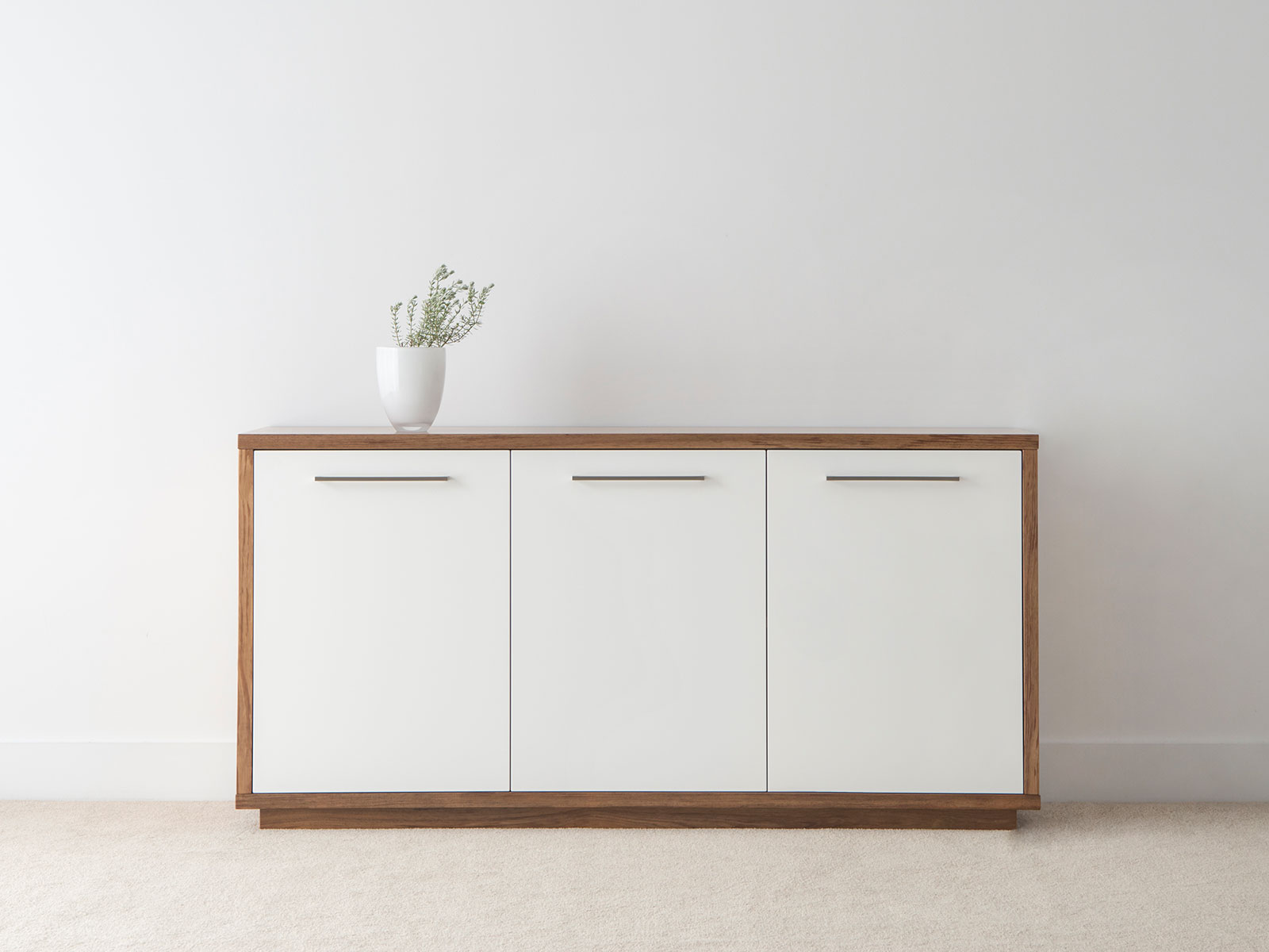 white buffet with timber feature and full base with long silver handles