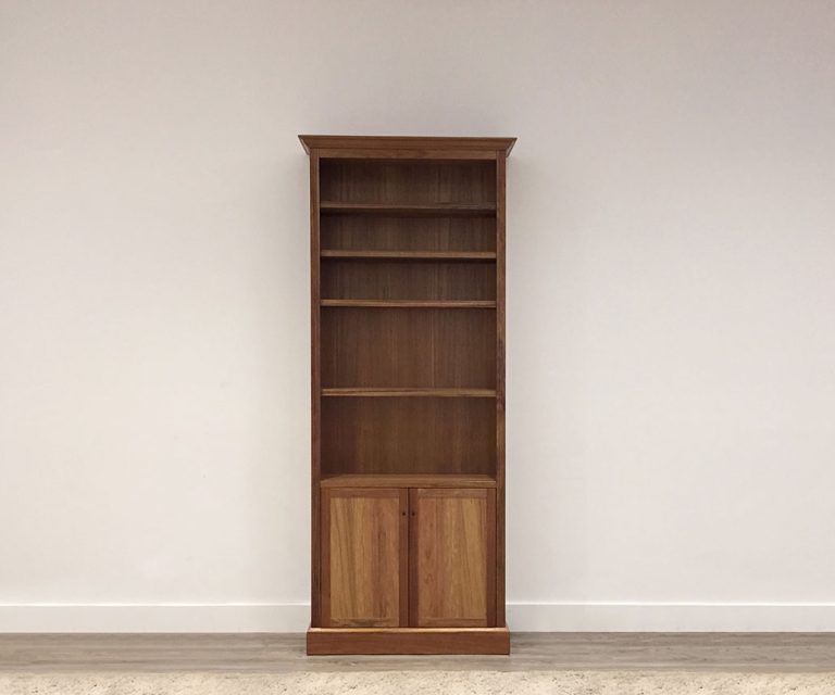 custom made slim wooden bookcase made with australian timber handmade in adelaide, with 6 shelves and below storage