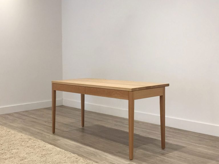 custom made study desk with two drawers, tapered legs, and slight overhang