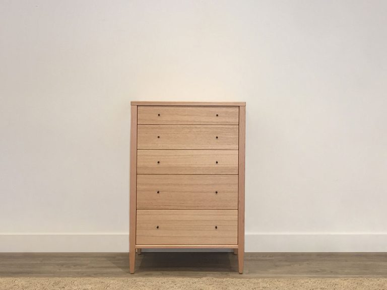 slim bedroom tallboy in mountain ash timber with 5 drawers and small black handles custom made in adelaide