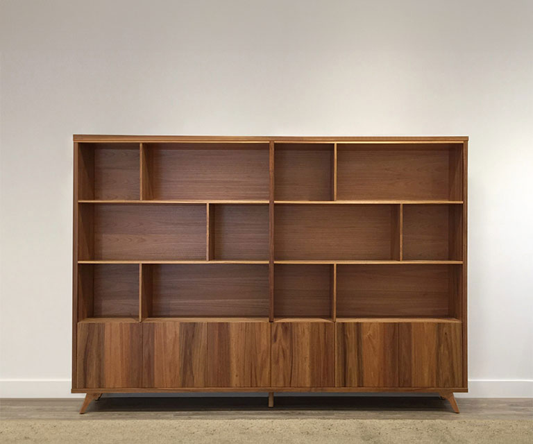 tasmanian blackwood timber abstract shelving unit with bottom storage