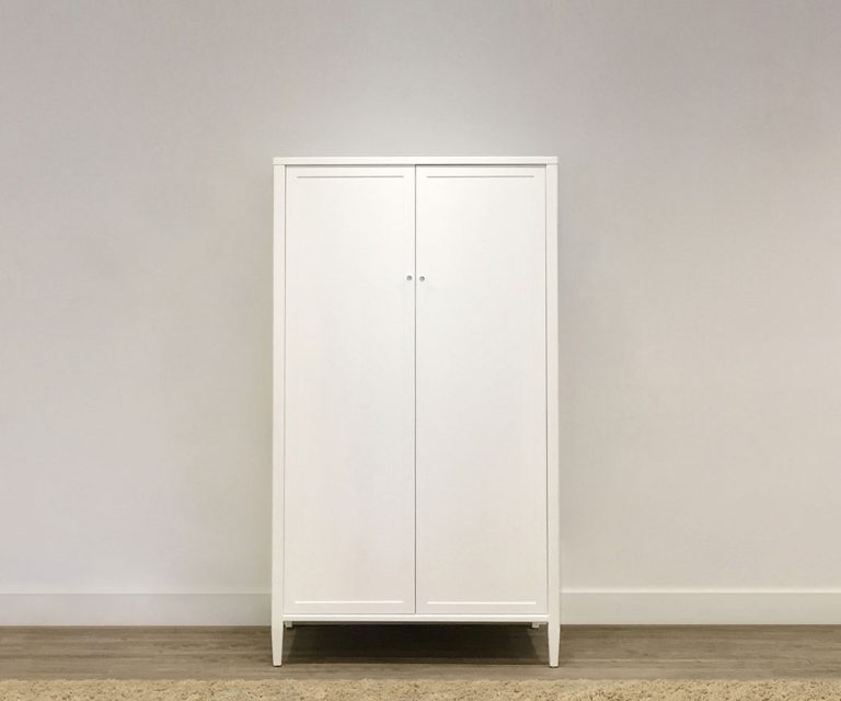 wooden custom wardrobe on legs with two doors and white finish