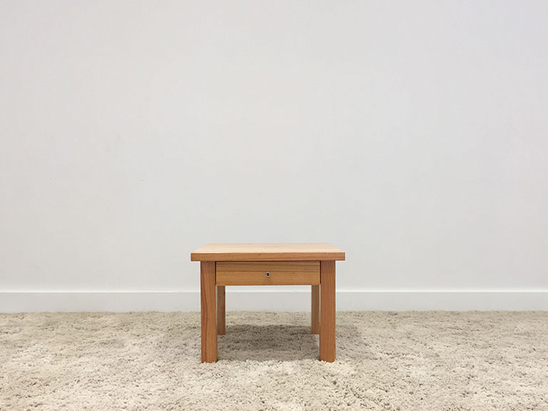 adelaide made timber side table with slight overhang and single drawer