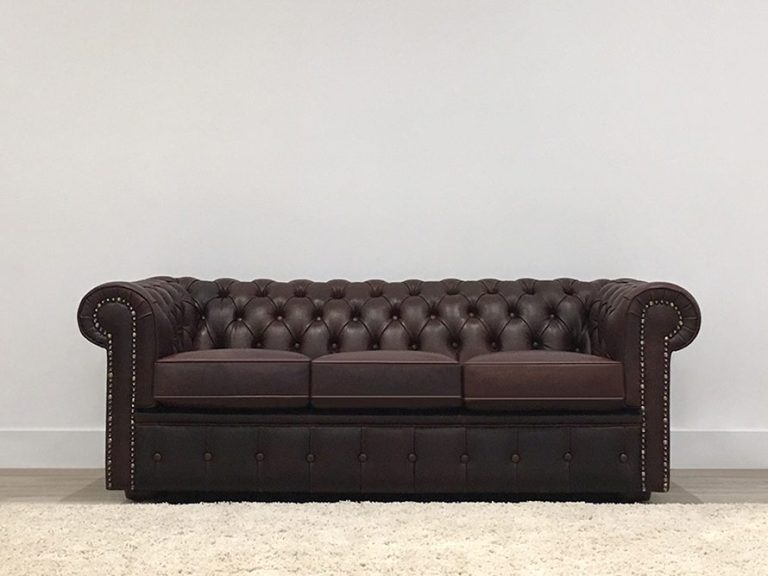 custom made 2 seater lounge with dark australian leather and button detail