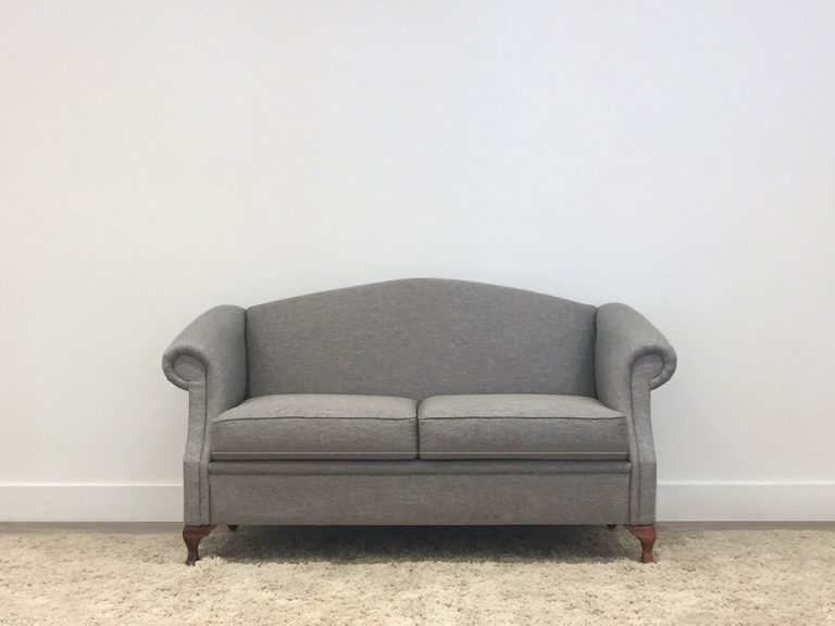 custom made 2 seater lounge with grey australian fabric and australian timber legs