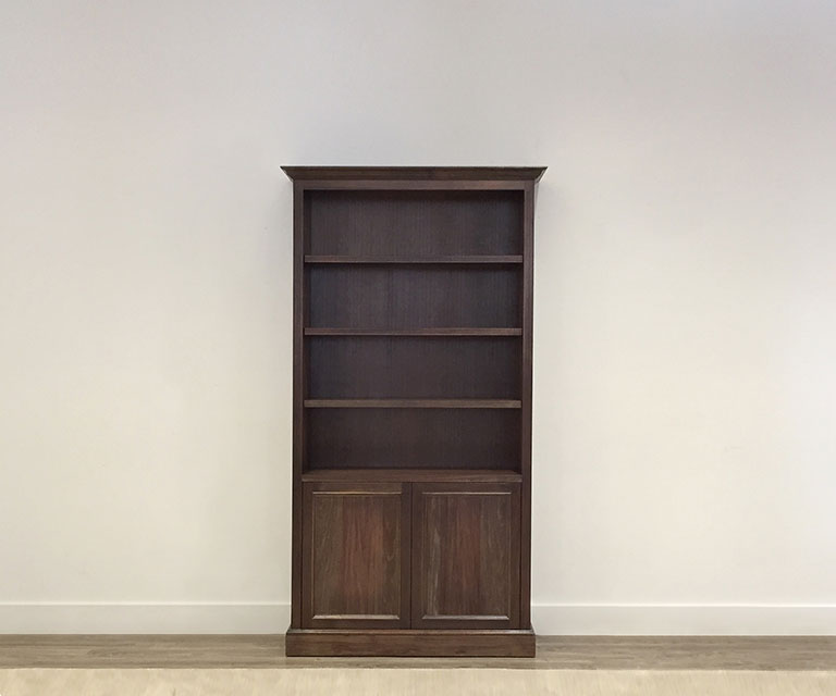 custom made australian timber bookcase with timber shelving and storage doors