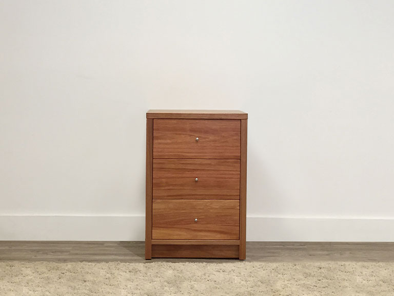 tall bedside table with small silver handle