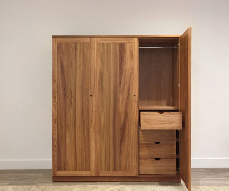 large freestanding wardrobe with internal storage drawers and full length hanging