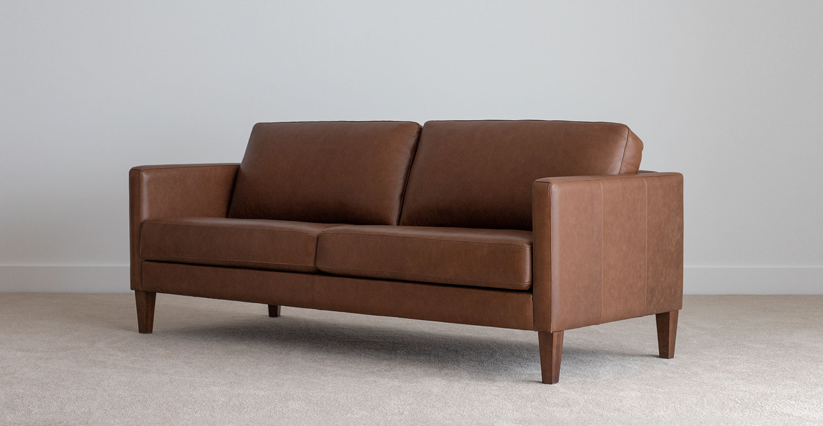 tan leather 3 seater leather sofa on leg