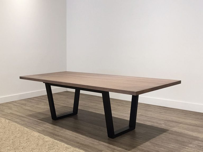 grey toned solid timber dining table with black legs to seat 10