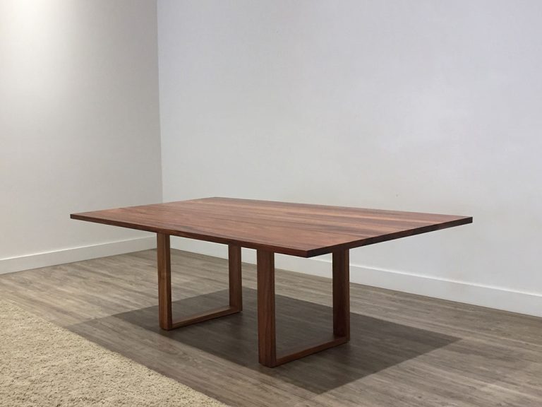 1.2m wide dining table in solid timber featuring contemporary open base