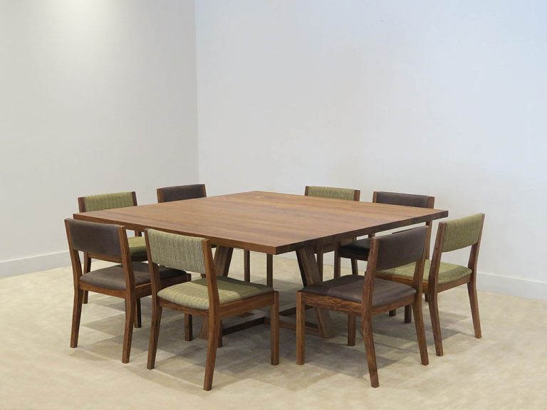 Tasmanian Blackwood 1.8m square dining table set with low back fabric and leather dining chairs as a dining suite